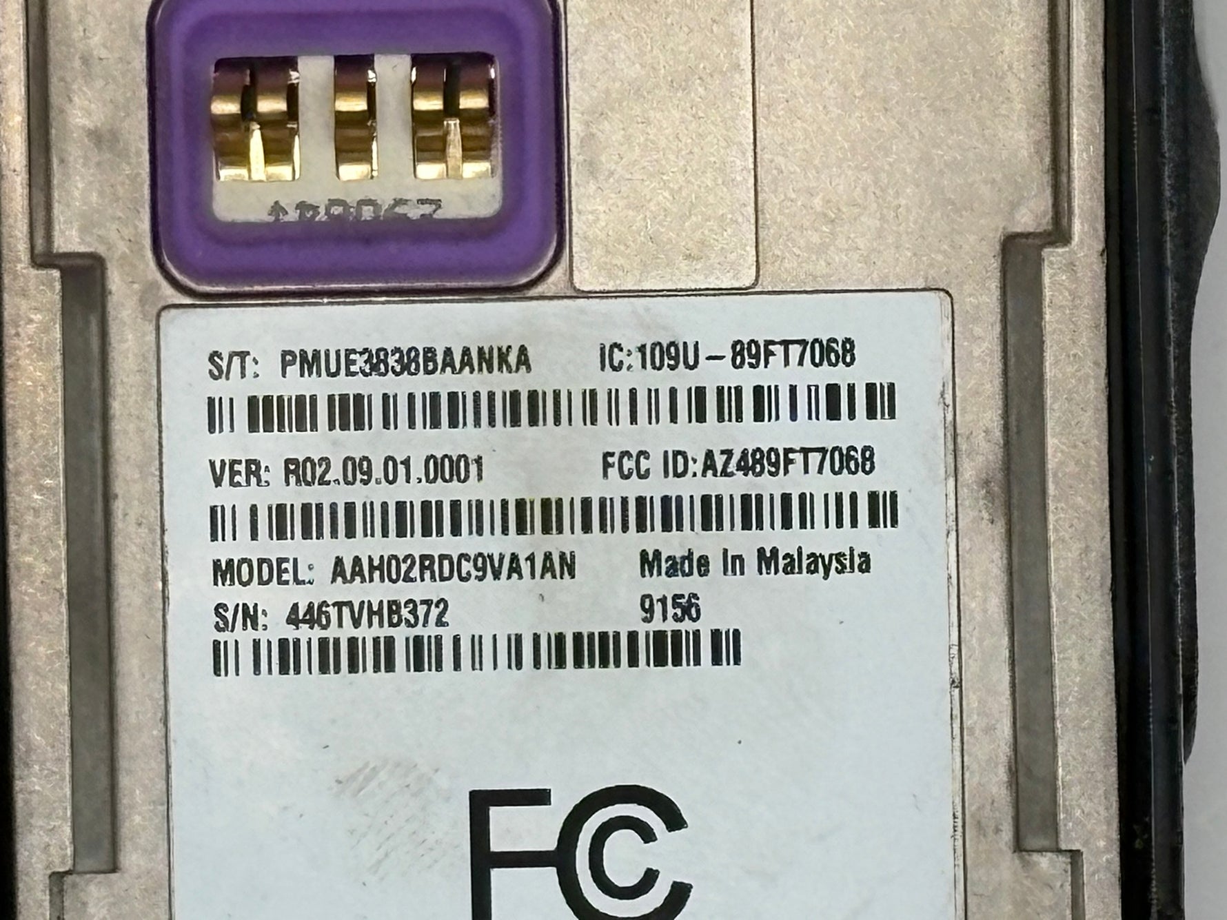 Close-up of a computer hardware component with label and branding