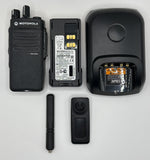 Motorola radio equipment including a radio, battery, charger, and accessories on a white background
