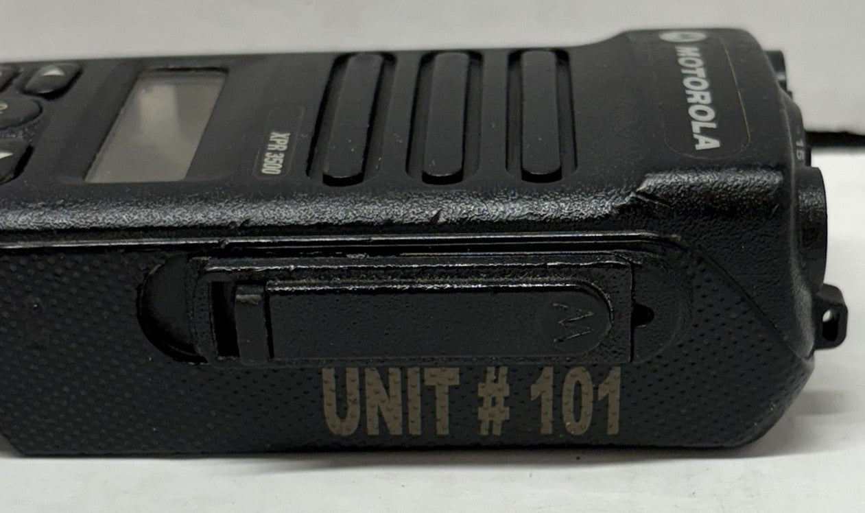 Black Motorola radio with 'UNIT #101' text on a white background